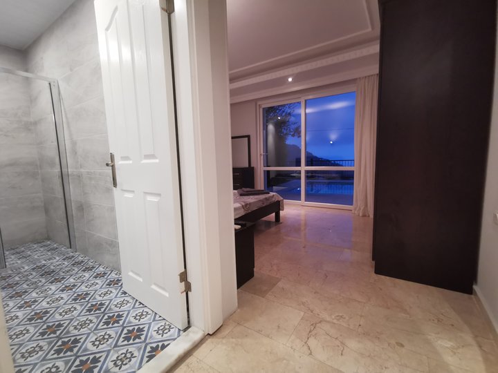 Master bedroom 1 with en-suite and private pool access