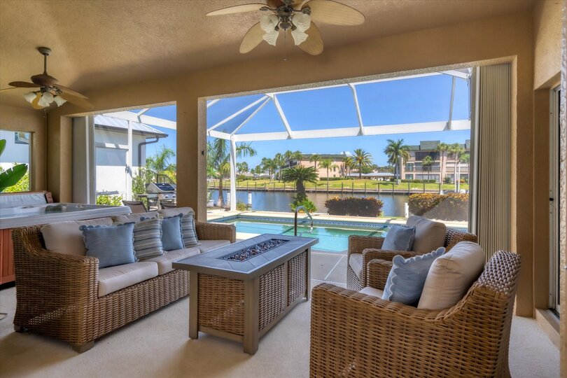 Lots of outdoor living space. Overlooking pool & canal