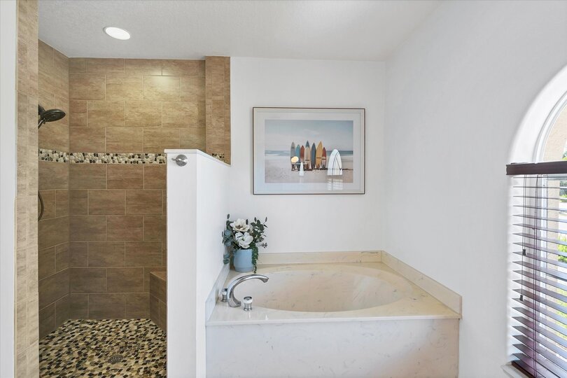 Ensuite features double vanities, walk-in shower and soaking tub