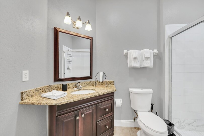 The ensuite master bathroom features plenty of space to get ready