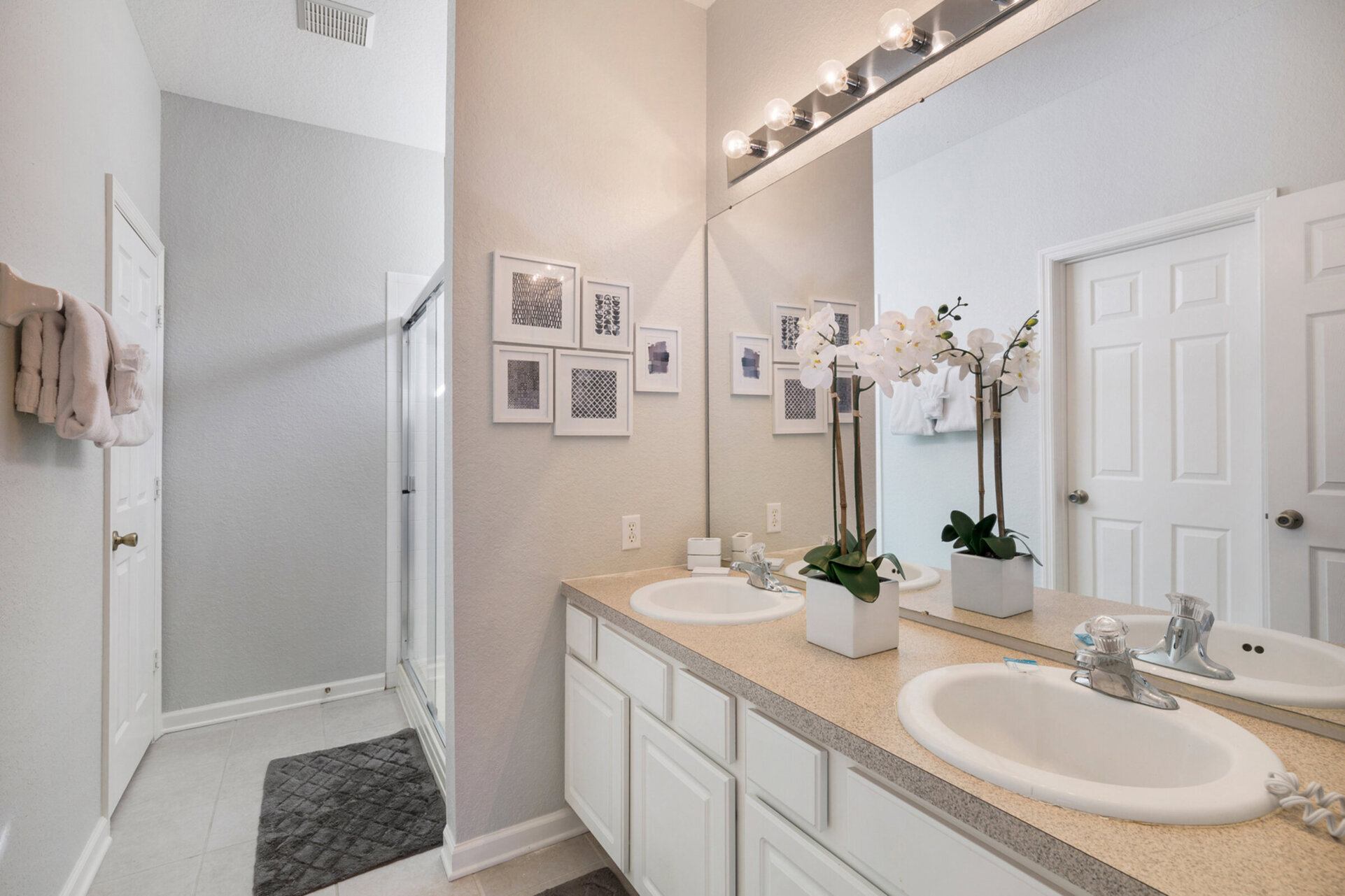 En-suite master bath with dual vanity and walk-in shower