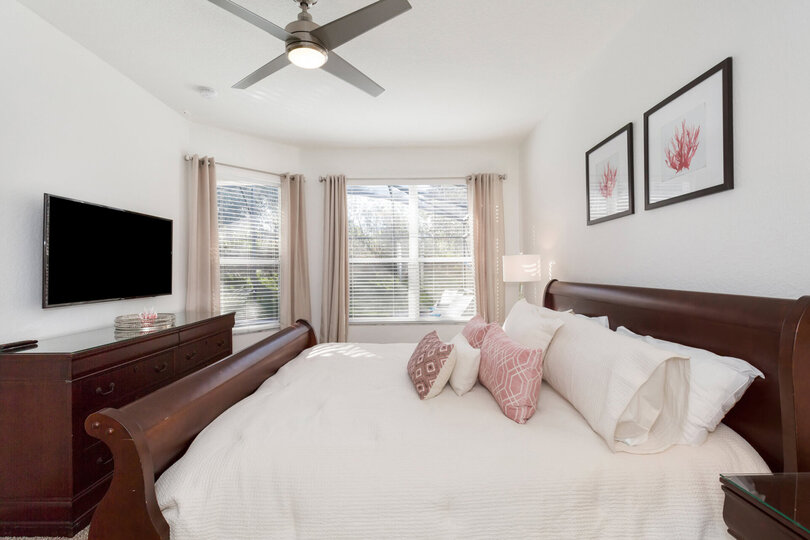This suite features a king size bed, 50-inch SMART TV, en-suite bathroom, and views to the pool area