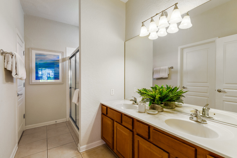 The ensuite bathroom has a dual vanity and walk-in show