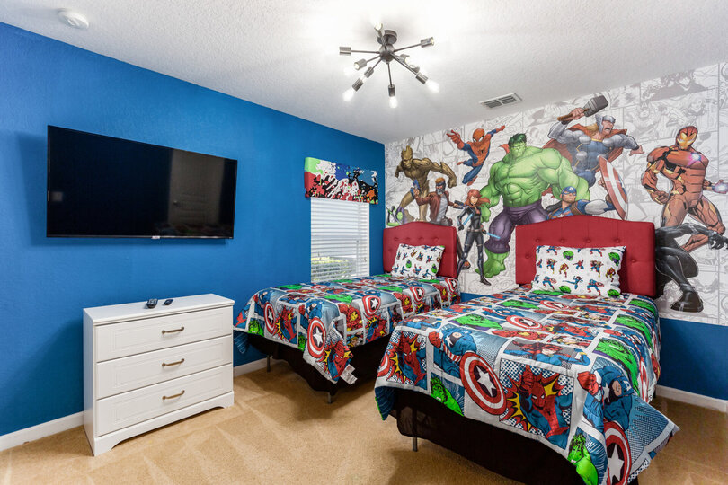 Superheros will love the second twin bedroom featuring a SMART TV