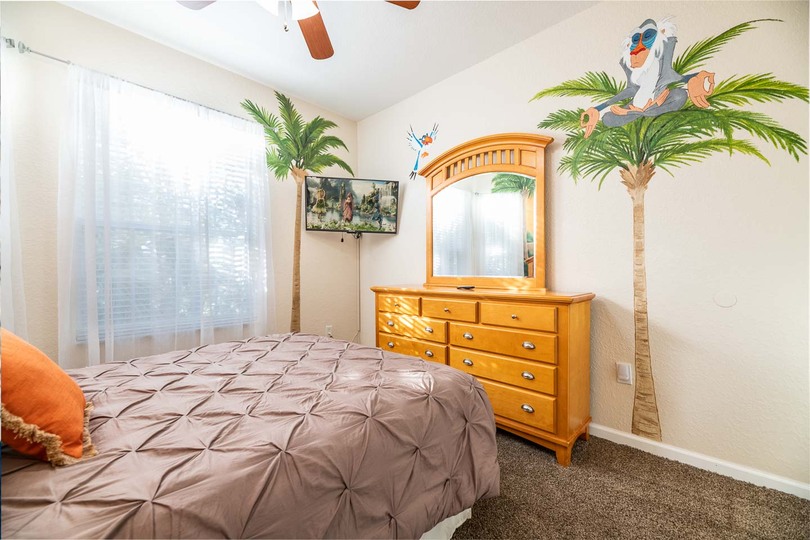 This bedroom features a queen-sized bed