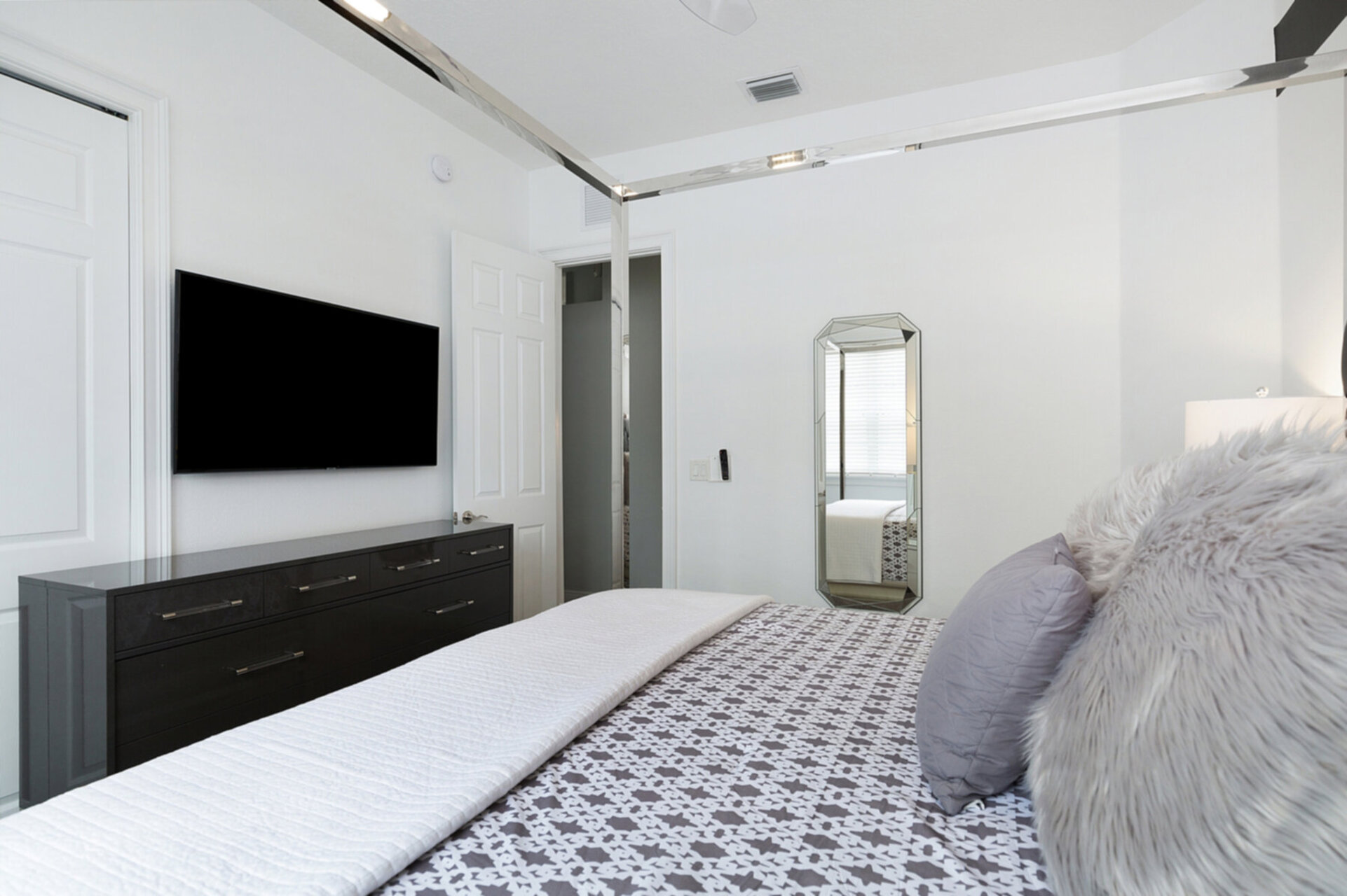SMART TV and dresser inside large closet