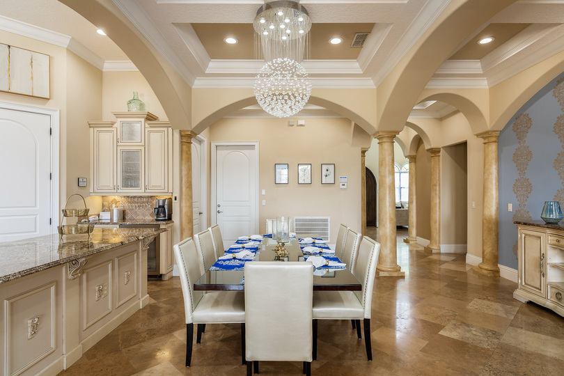 Host a family-style dinner at the formal dining table with seating for up to 8