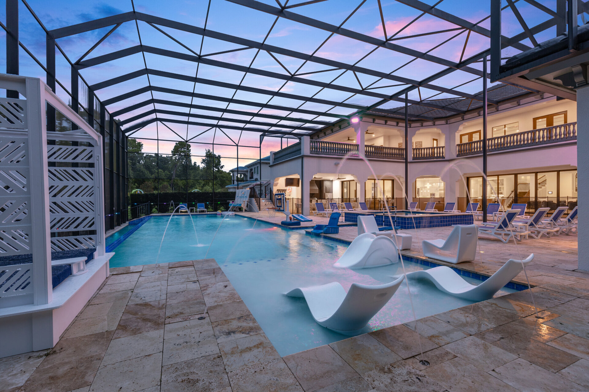 Custom water features in the pool will make you want to swim all day