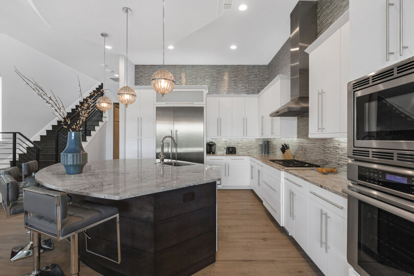 The kitchen has stainless steel appliances