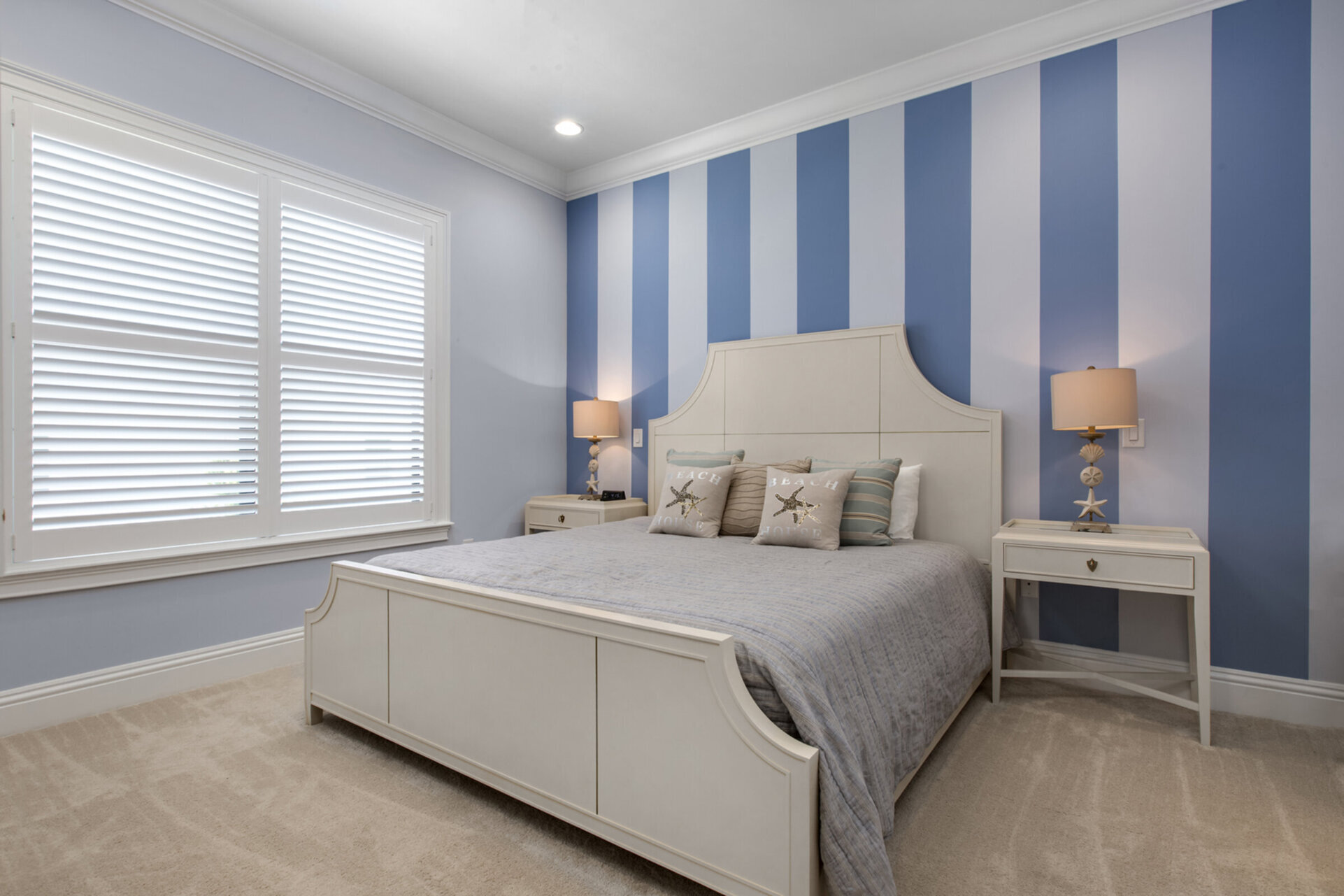 Vacation in the Destin Suite in this second floor bedroom with a king bed