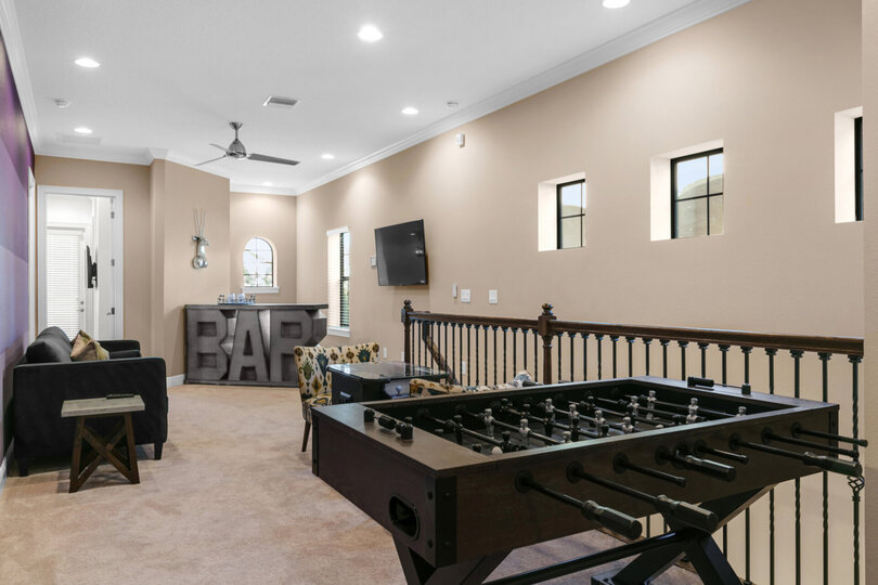 The loft space also has a foosball and seated arcade table