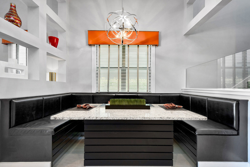 The booth-style dining area allows you to enjoy your meals with family comfortably