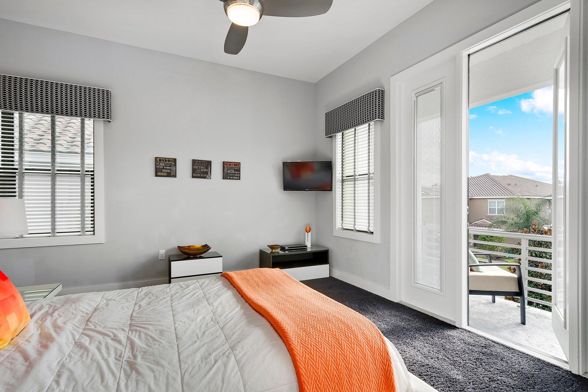 The bedroom also features a 32-inch TV and access to a private balcony