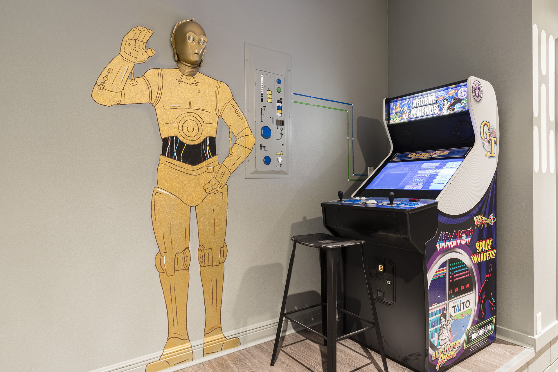 The games room has a Golden Tee Arcade System