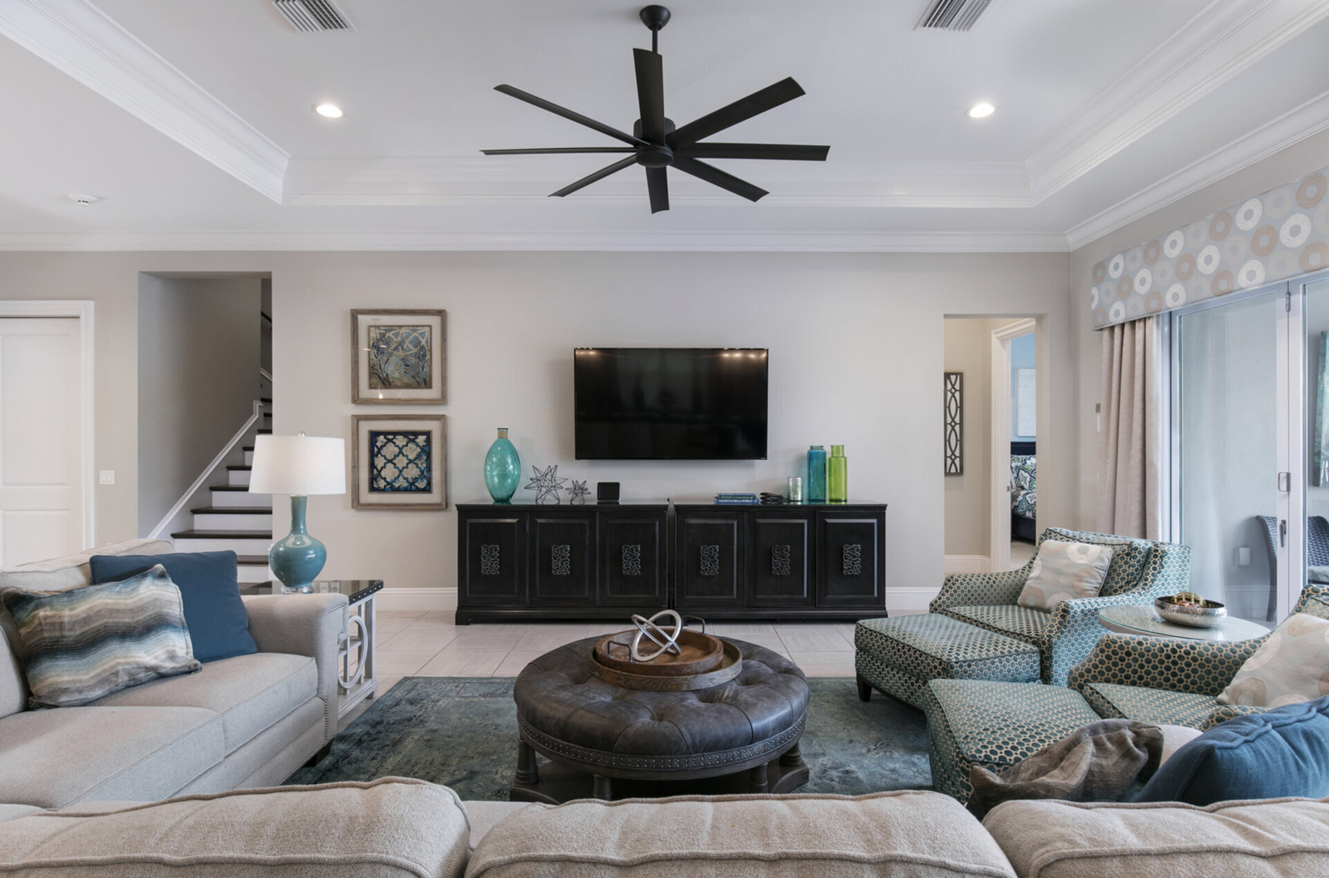 The living area features a 70-inch SMART TV