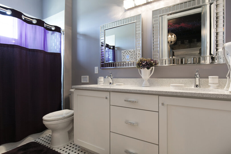 A private bathroom for the princess features dual vanity and shower/tub combination