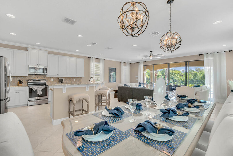 A gorgeous formal dining table has 6 seats and a bench for 4 for a total of 10 guests