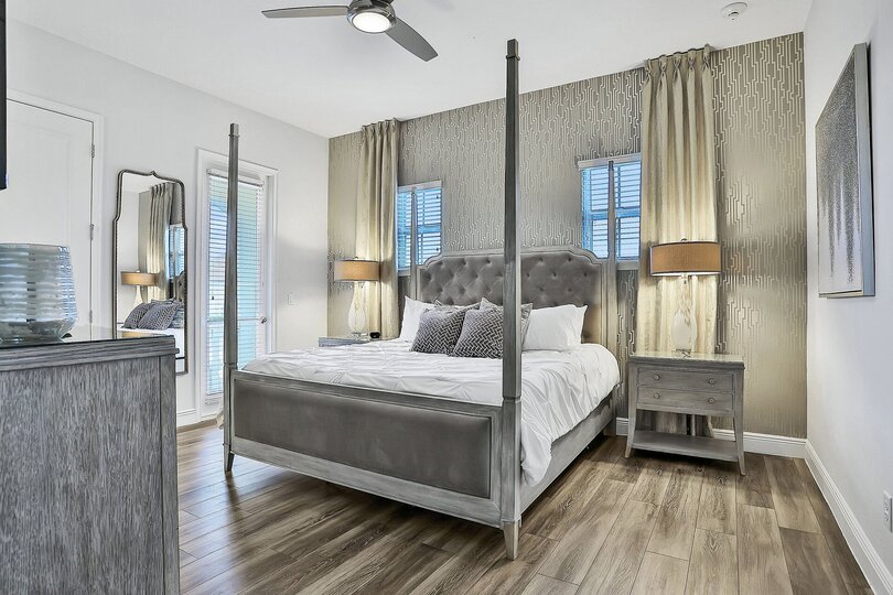 This master suite has a king bed and private access to the second-floor balcony