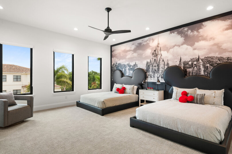 Two queen-size beds in an upstairs bedroom