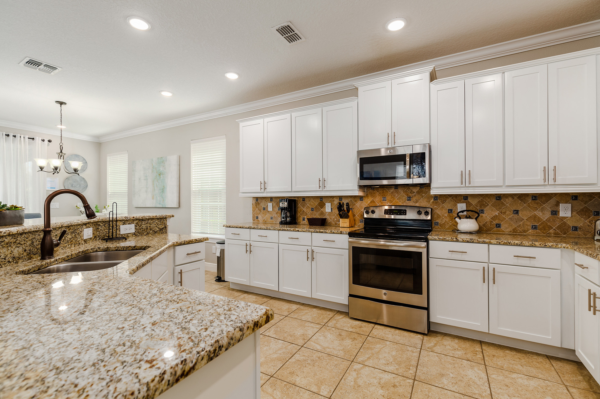 The kitchen features stainless steel appliances.