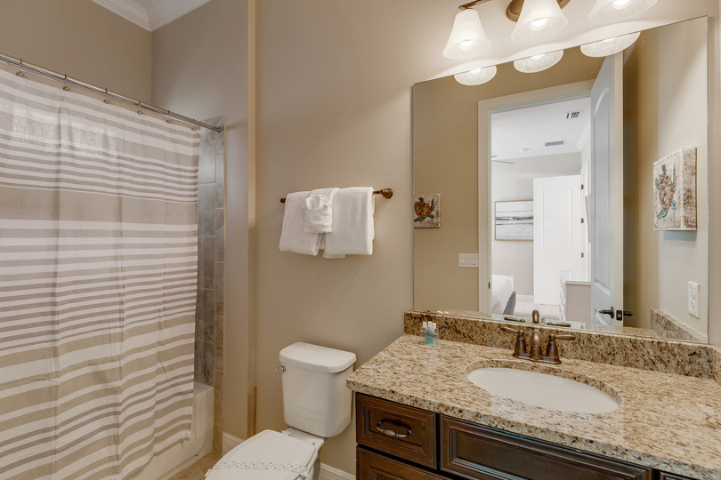The en-suite bathroom with a combo tub/shower