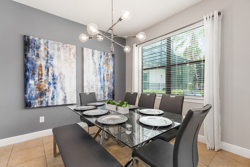One side of the formal dining table has bench seating