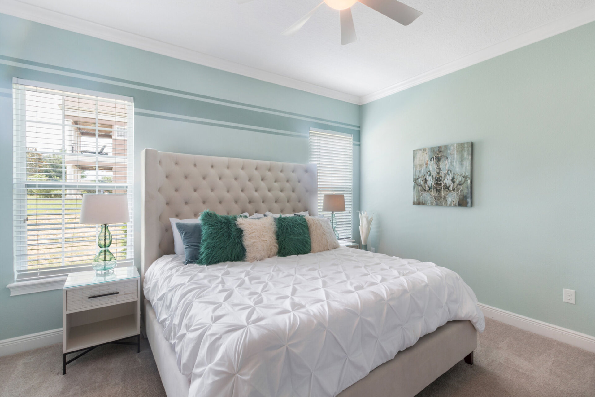 The downstairs Master Suite features a comfortable King sized bed and luxurious details