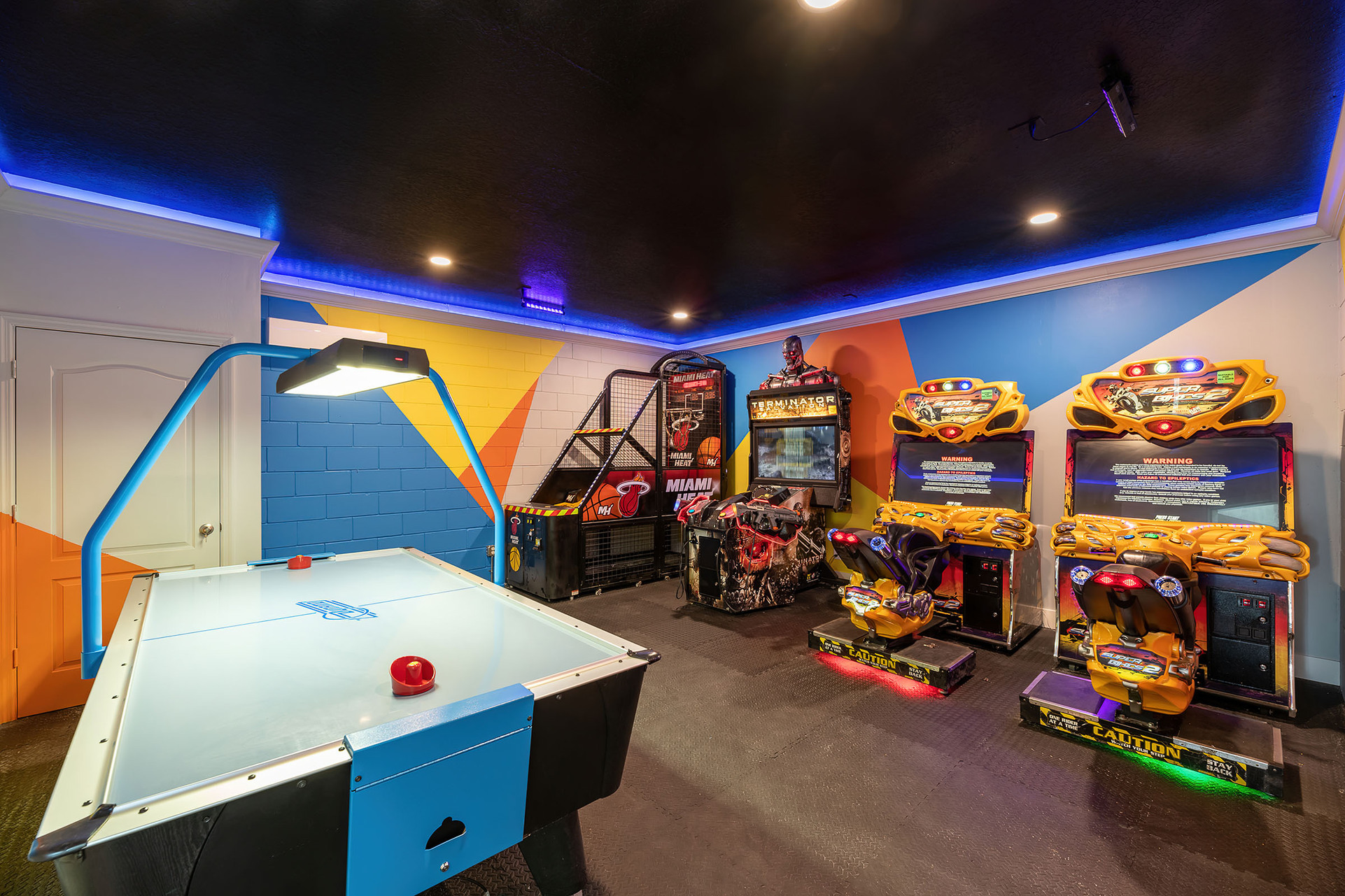 Challenge your family to friendly competition with air hockey, Miami Heat basketball, Terminator Salvation, and dual Super Bikes 2 racers
