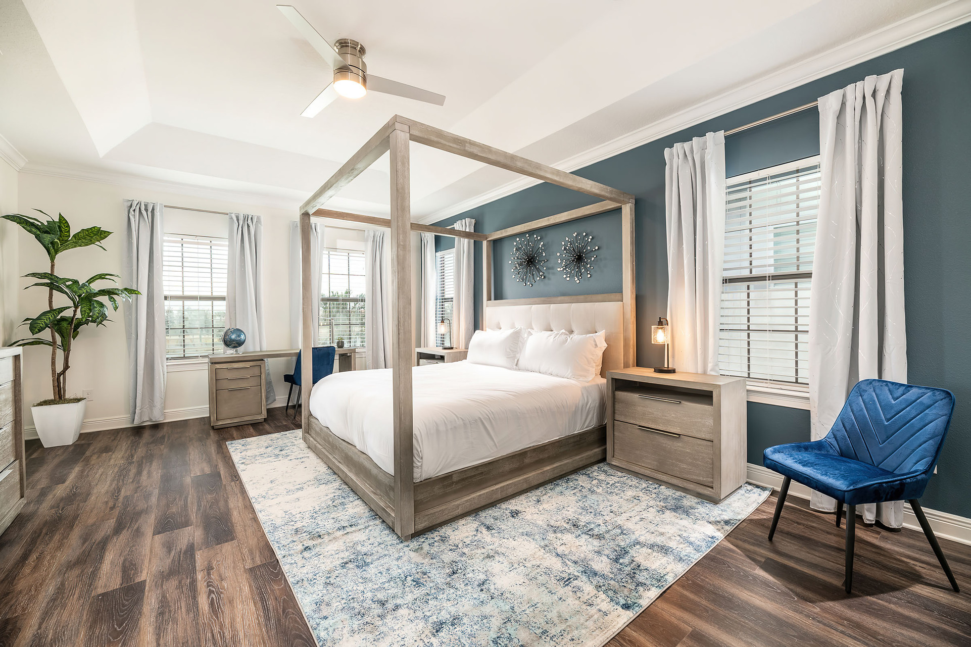 The rear master suite includes an en suite bathroom with shower and separate garden tub and a private balcony with breathtaking sunset views