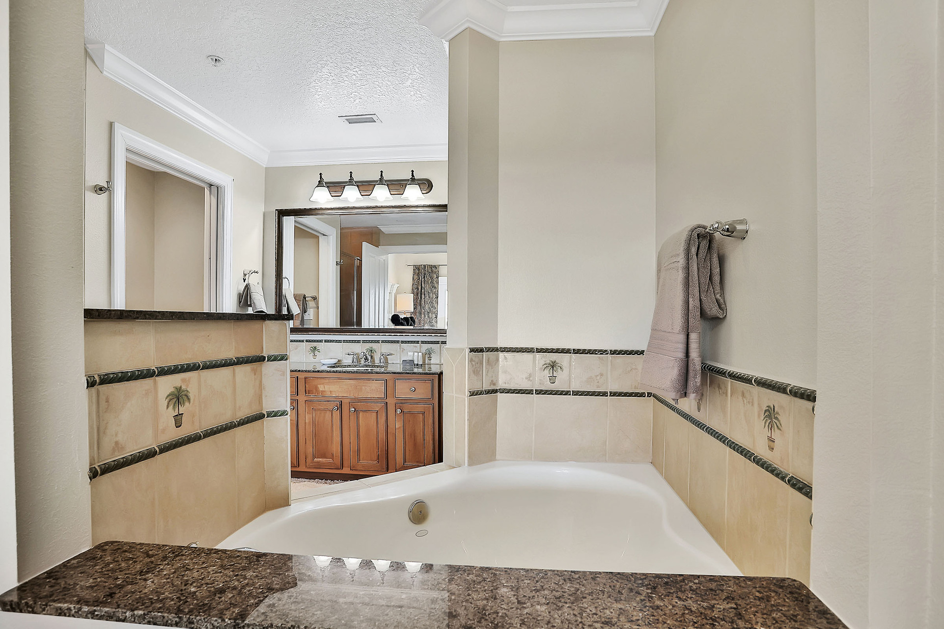The master suite features a corner garden tub, perfect for unwinding after a day of adventures
