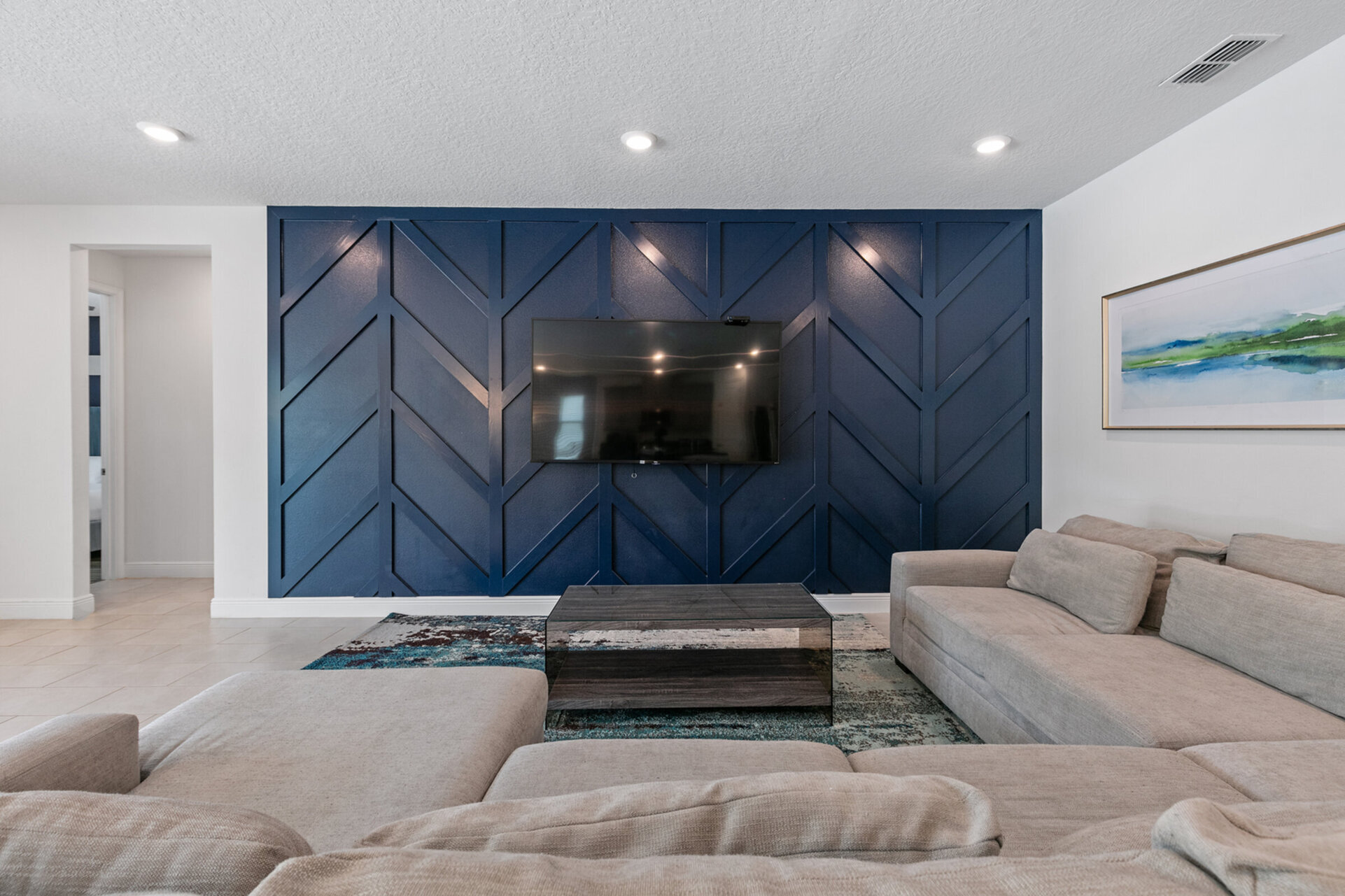 Get comfortable on the spacious sectional sofa and catch up on your favorite TV shows