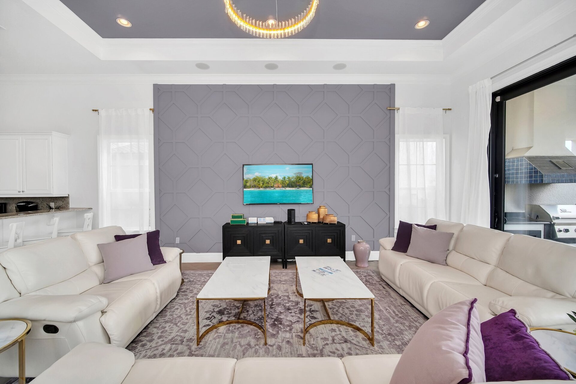 Welcome to our snug living area, where a plush sofa invites you to sink in and relax. Vibrant and inviting, it's the perfect spot to unwind and hang out with loved ones.