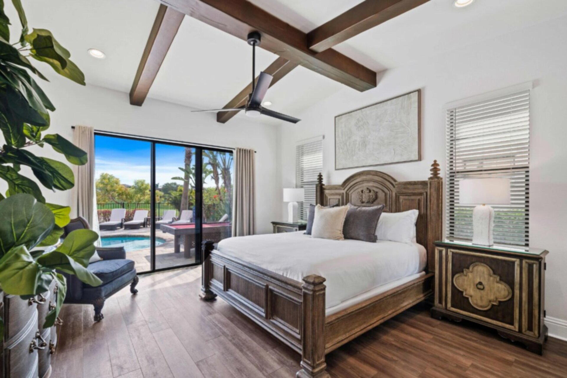 The downstairs master bedroom features a king bed and en-suite bathroom