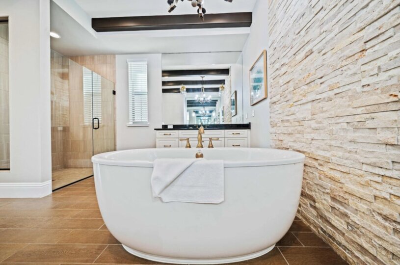En-suite bathroom with large soaking tub and glass door walk-in shower