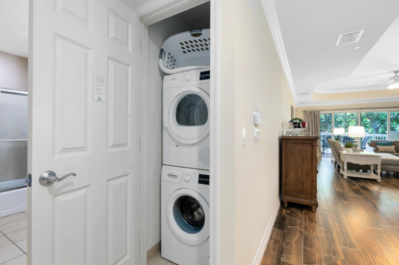 The ground floor laundry area has a washer and dryer