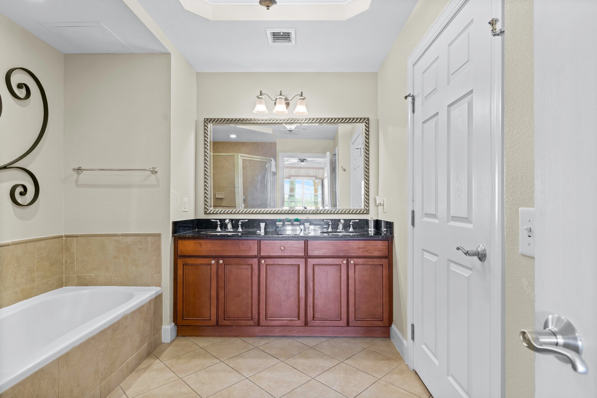 Enjoy the convenience of an en-suite bathroom featuring a walk-in shower for a refreshing start to your day