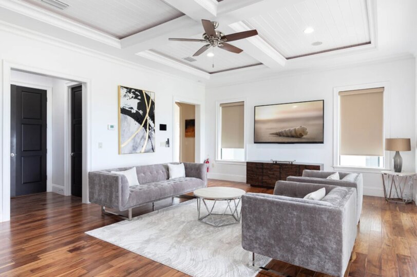Gather in the 2nd floor loft area, a versatile space perfect for lounging, watching movies, or enjoying casual conversations