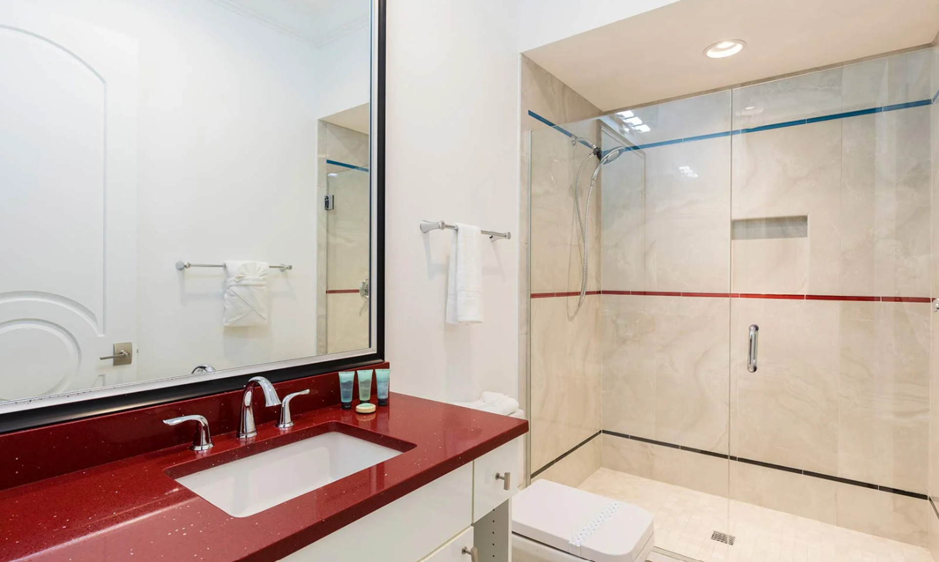 Refresh yourself in the modern shower area, featuring sleek fixtures and ample space for a rejuvenating experience