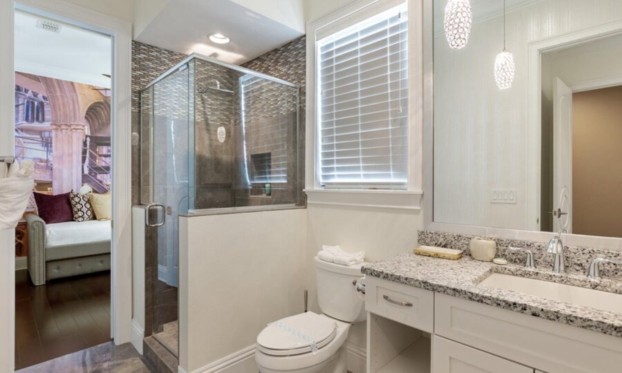 Refresh yourself in the modern shower area, featuring sleek fixtures and ample space for a rejuvenating experience