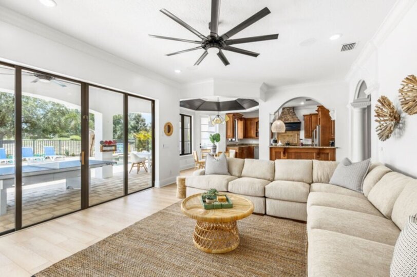The living room, with its plush sectional sofa and accent chair, creates the ideal spot for the whole family to gather and share stories of the day's adventures.