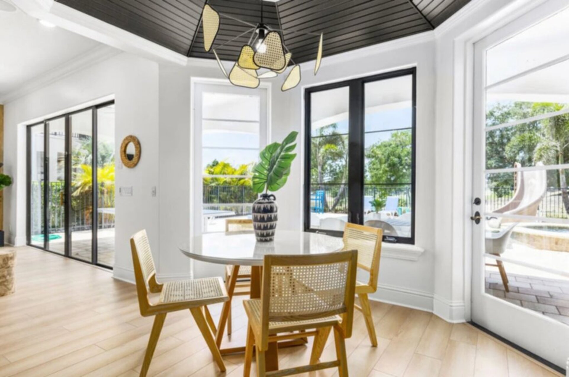A cozy breakfast nook with seating for four offers a perfect spot for a casual morning coffee or late-night snacks.