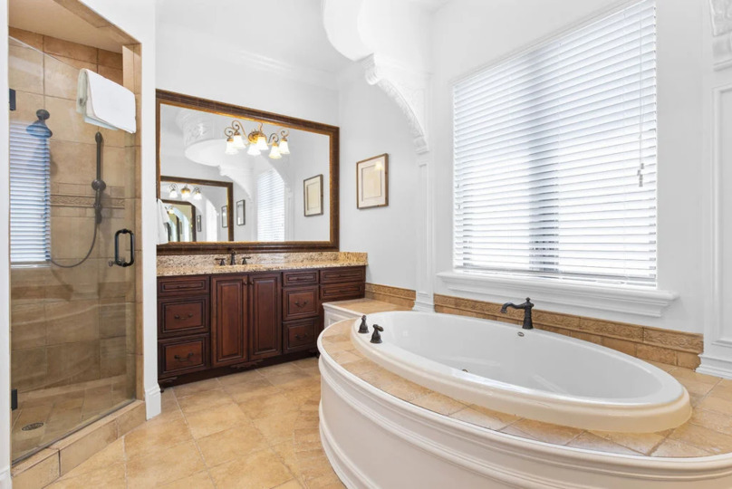 Enjoy the convenience of an en-suite bathroom featuring a walk-in shower for a refreshing start to your day