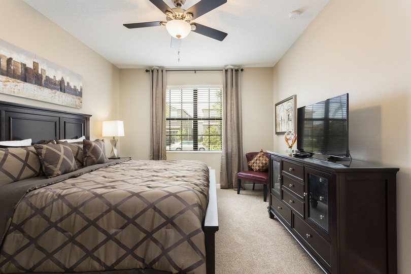 The bedroom has a flatscreen TV and ensuite bathroom
