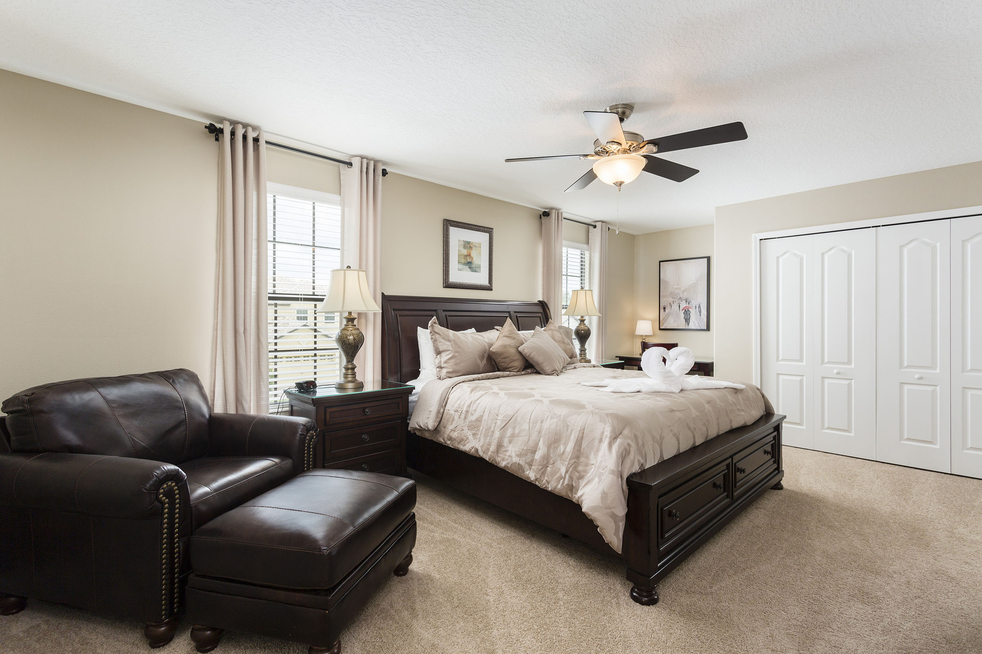 This second floor master bedroom is very spacious and boasts a king bed and plush armchair