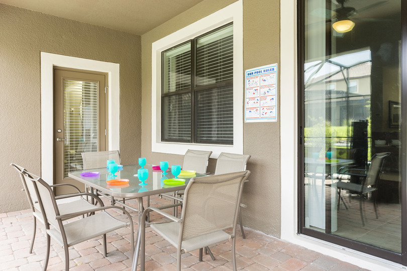 Dine al fresco at the outdoor dining table with seating for 6, and a second table with seating for another 6.