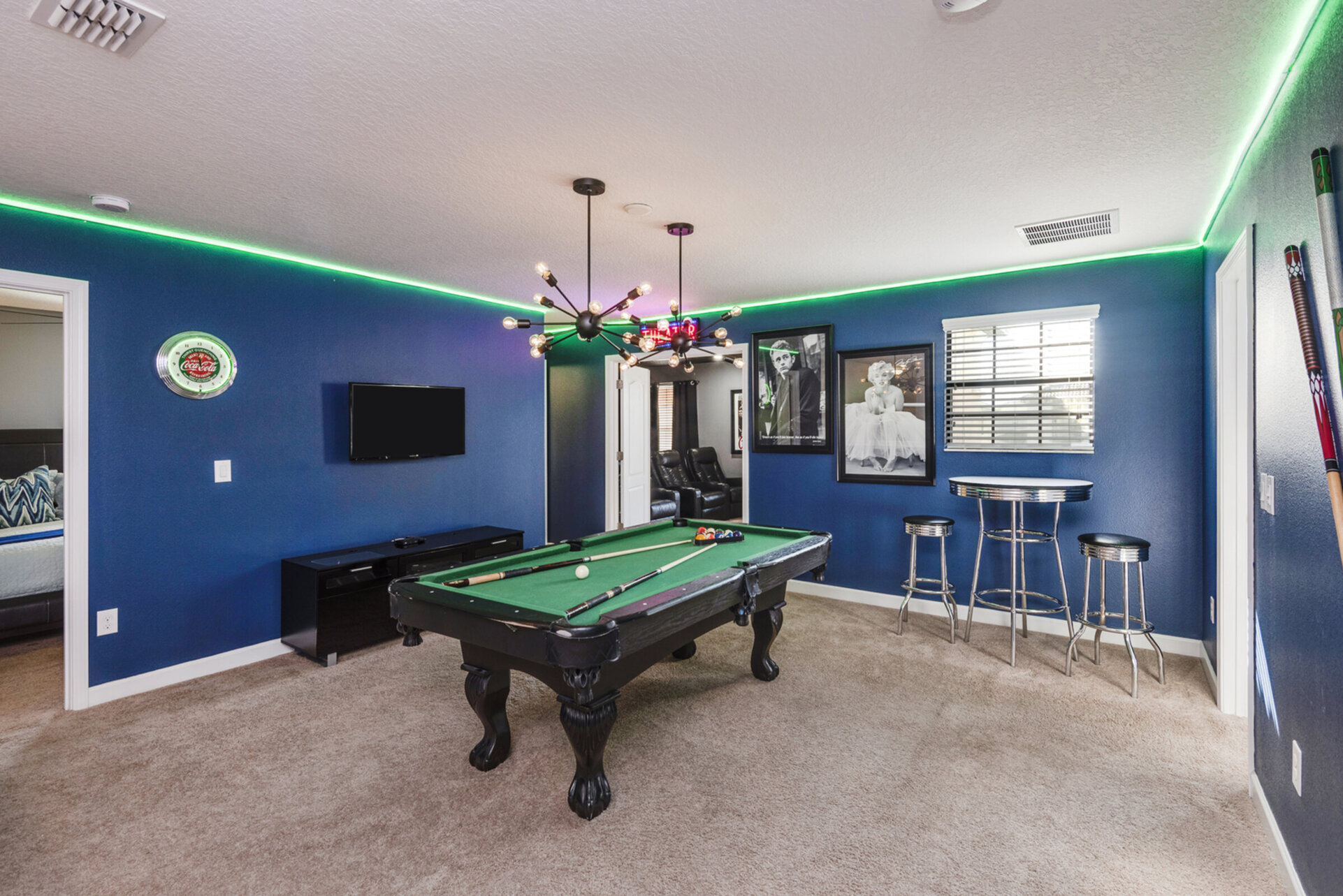 A loft game room with a pool table