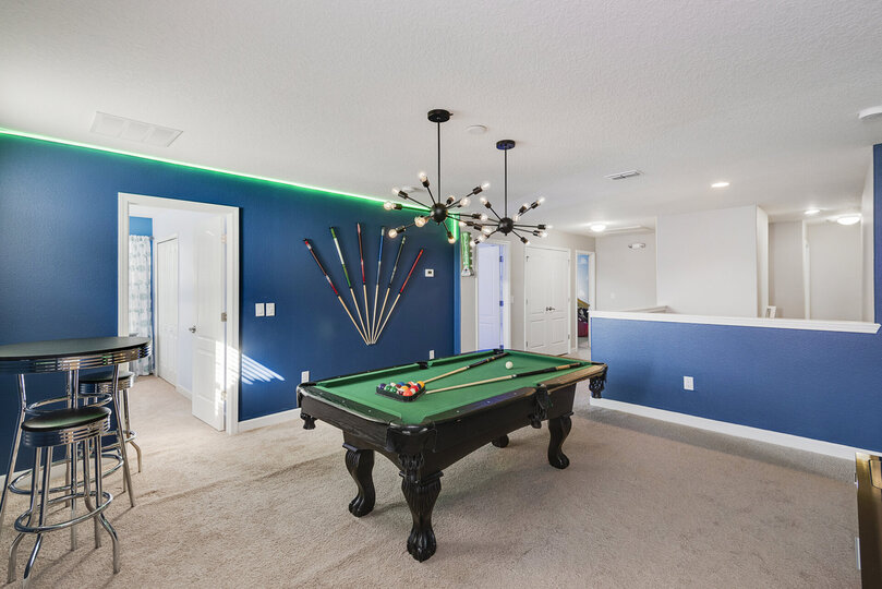 Play a game and hang out with family in this cool loft area game room
