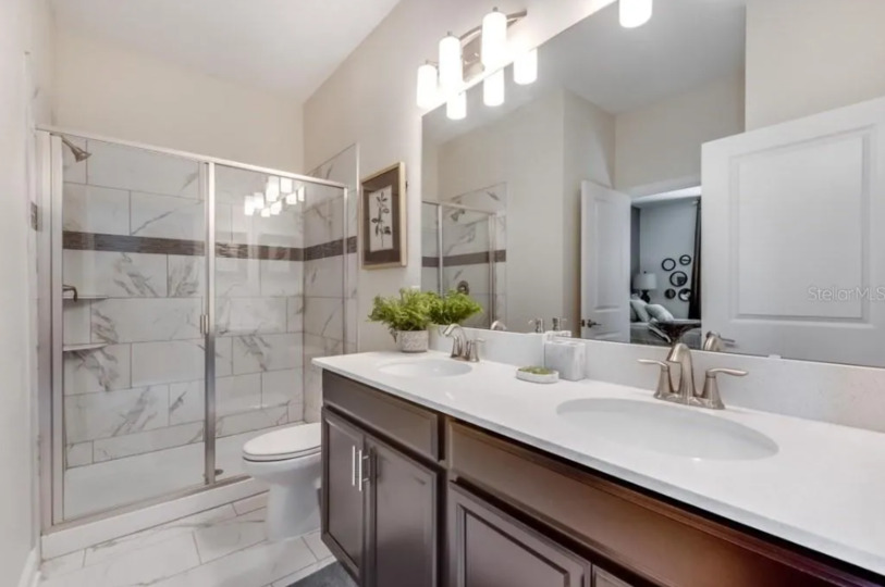 Enjoy the convenience of an en-suite bathroom featuring a walk-in shower for a refreshing start to your day