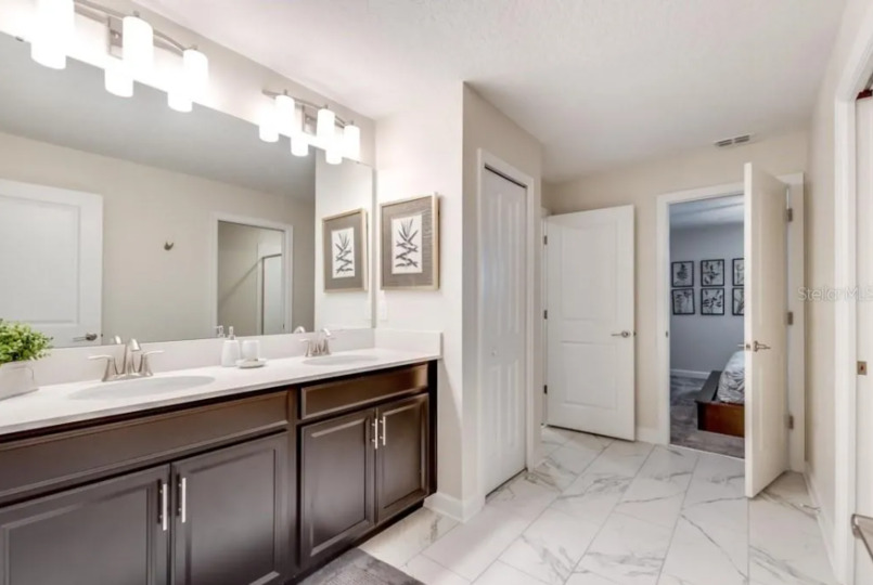 Enjoy the convenience of an en-suite bathroom featuring a walk-in shower for a refreshing start to your day