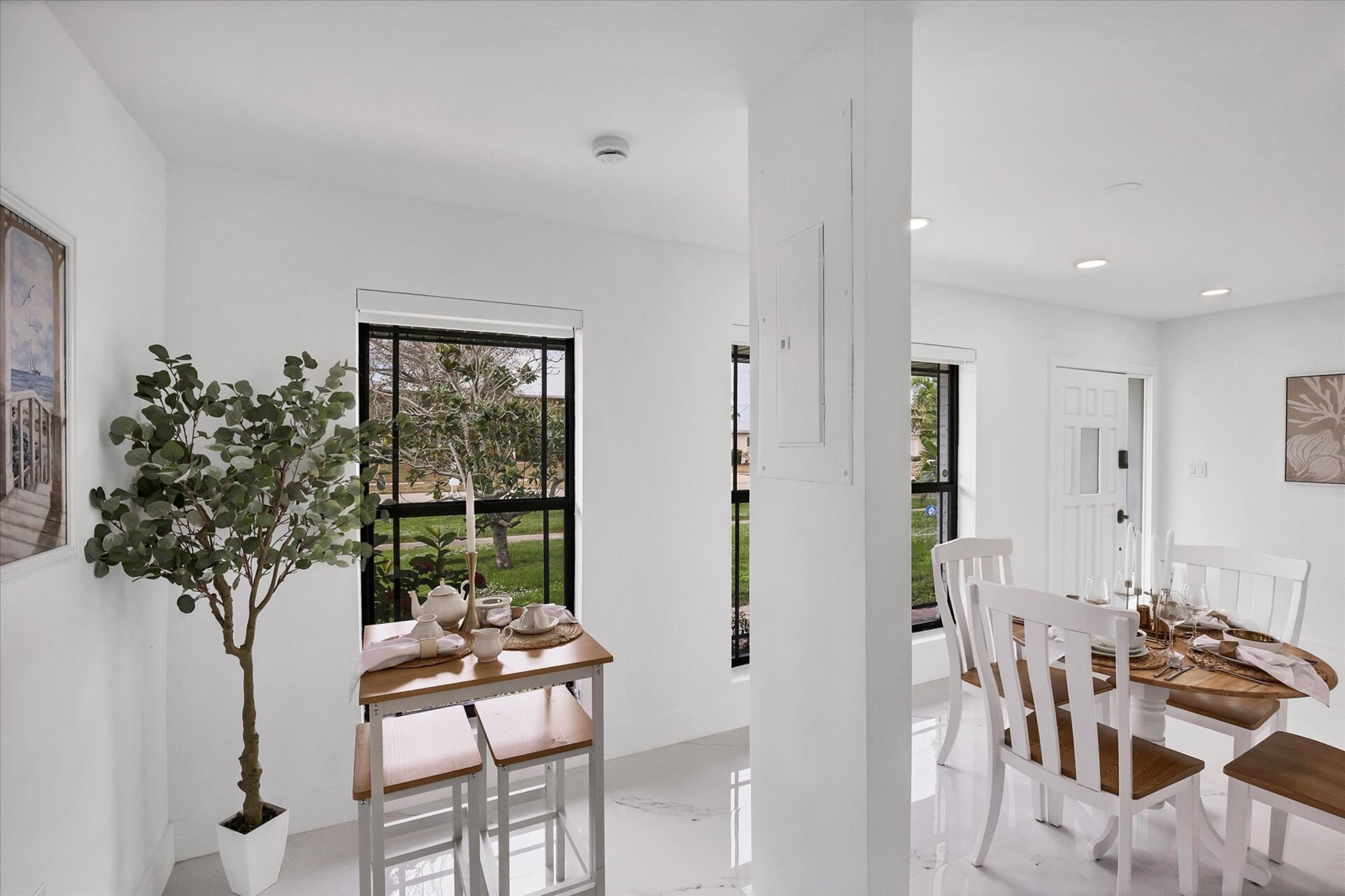 Dining area. Dining table seats 4 with additional seating at kitchen island, bar top table, and kitchen nook area